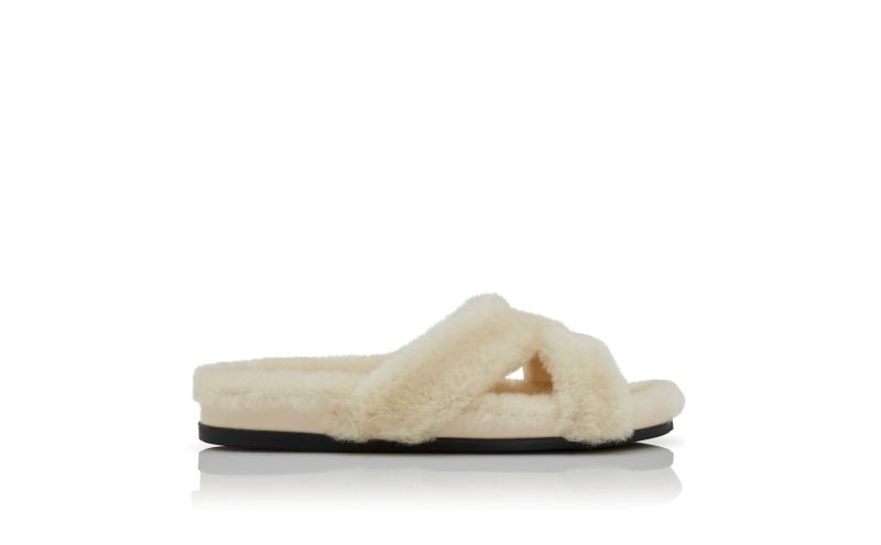 Side view of Chilpa, Cream Shearling Open Toe Flat Mules - US$1,095.00