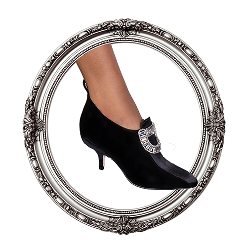 Image of a black velvet bootie inside a silver frame.